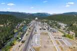 Discover this prime real estate opportunity nestled in a picturesque mountain town, adjacent to a flowing river and scenic train tracks.