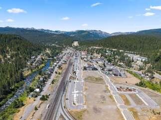 Discover this prime real estate opportunity nestled in a picturesque mountain town, adjacent to a flowing river and scenic train tracks.