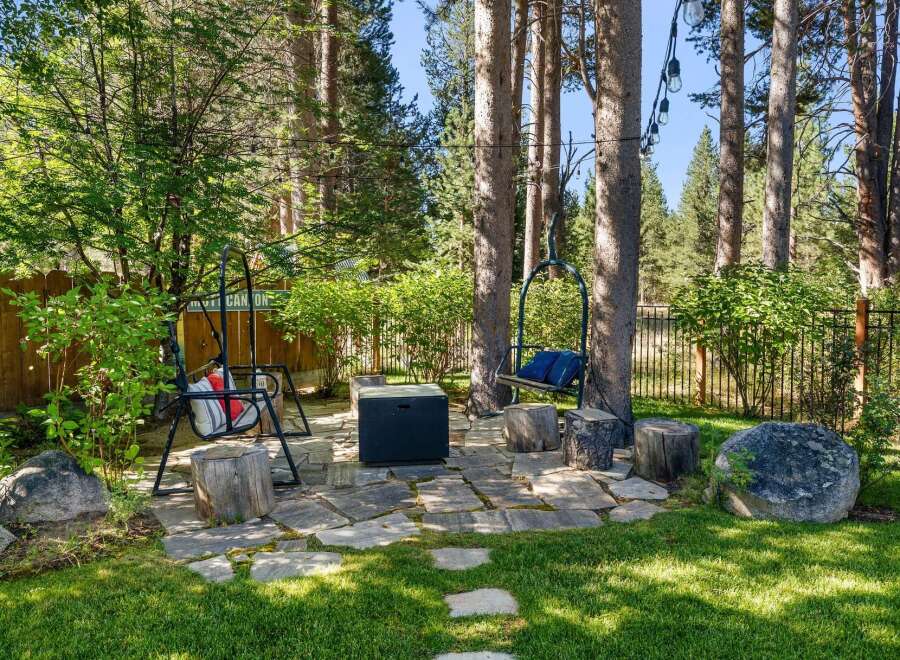 Enjoy the outdoors in this charming backyard oasis, perfect for relaxation and entertaining.