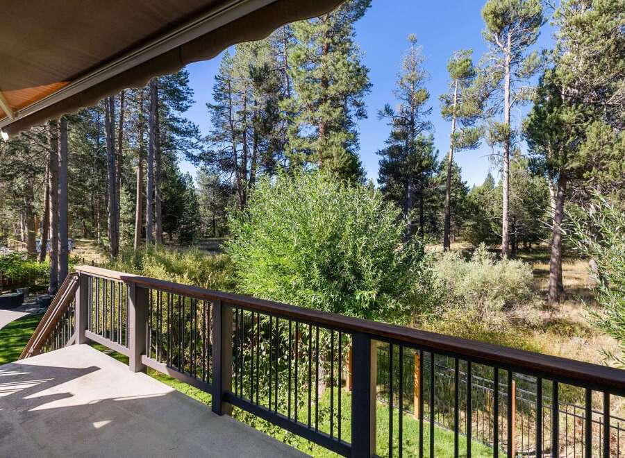 Enjoy the serene mountain views from this expansive deck, perfect for outdoor living and entertaining.