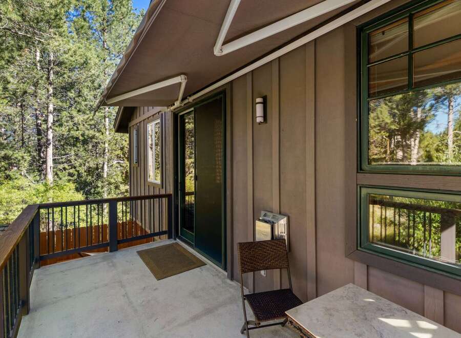 Enjoy the serene mountain views from this charming cabin's private balcony, perfect for morning coffee or evening relaxation.