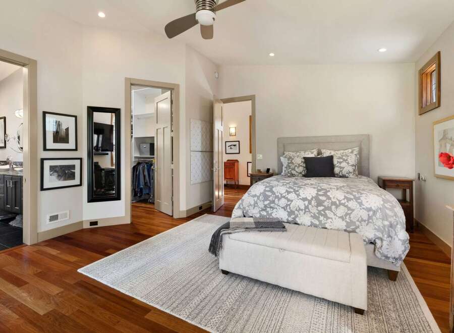 Experience luxurious living in this master suite, featuring a spacious walk-in closet and an en-suite bathroom.