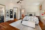 Experience luxurious living in this master suite, featuring a spacious walk-in closet and an en-suite bathroom.