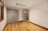 This inviting room features a spacious closet with double doors, perfect for ample storage.
