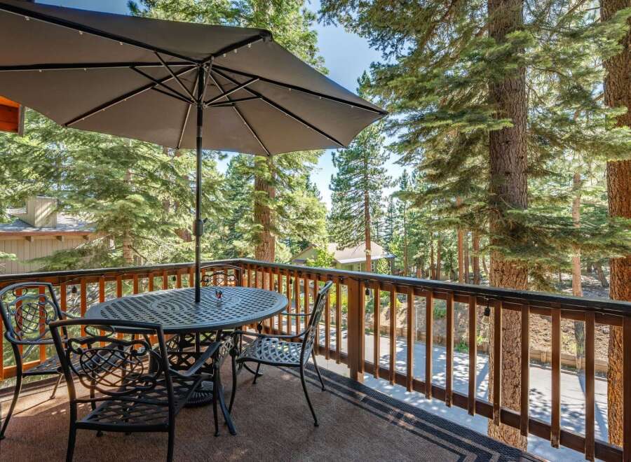 Enjoy the serene mountain views from this charming balcony, perfect for outdoor dining or morning coffee.