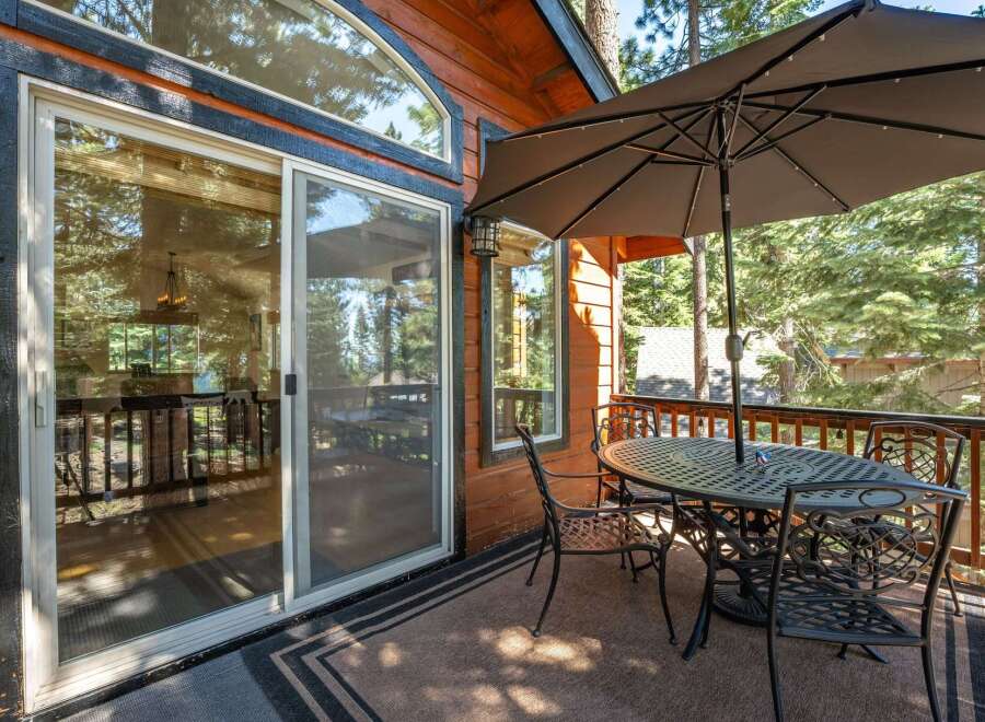 Enjoy outdoor living on this charming deck, perfect for al fresco dining or relaxing with a view.