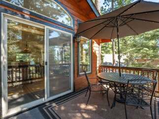 Enjoy outdoor living on this charming deck, perfect for al fresco dining or relaxing with a view.