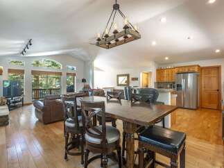 Experience the perfect blend of rustic charm and modern comfort in this spacious open-concept living area.