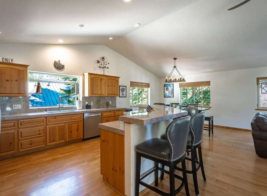 Experience the perfect blend of rustic charm and modern convenience in this spacious kitchen.