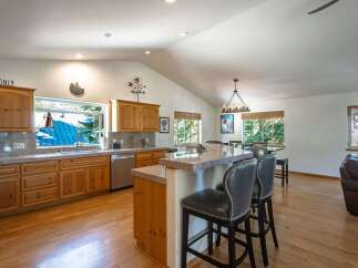 Experience the perfect blend of rustic charm and modern convenience in this spacious kitchen.