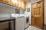 This laundry room features a stacked LG washer and dryer set, perfect for maximizing space.