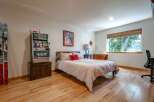 This unique bedroom features a vintage slot machine, perfect for a game room or a fun-themed space.