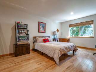 This unique bedroom features a vintage slot machine, perfect for a game room or a fun-themed space.
