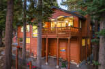 Experience the ultimate mountain getaway in this stunning wooden home, nestled amongst towering pine trees.
