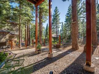 Enjoy the serene mountain lifestyle from this charming property nestled amongst tall pine trees.