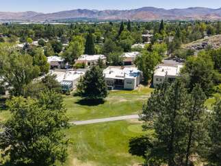 Experience luxury living in this stunning property, nestled amidst lush greenery and a picturesque golf course.