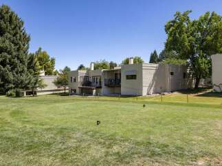 Enjoy stunning golf course views from this property, featuring a spacious backyard perfect for outdoor entertaining.