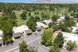 Discover this stunning property nestled beside a lush golf course, offering breathtaking mountain views in the distance.