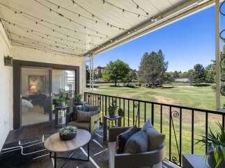Enjoy breathtaking golf course views from this charming balcony, perfect for morning coffee or evening relaxation.