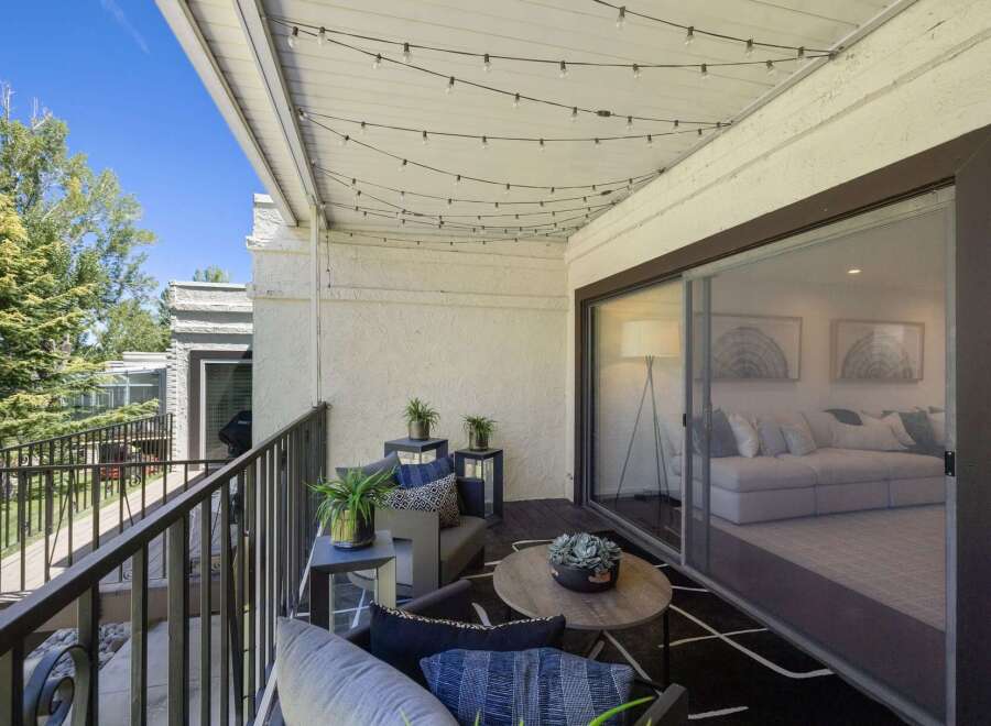 Enjoy outdoor living on this charming balcony, perfect for relaxing or entertaining.