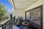 Enjoy outdoor living on this charming balcony, perfect for relaxing or entertaining.