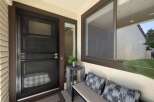 Enhance your home's curb appeal with a stylish screen door, perfect for allowing fresh air while keeping insects out.