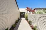 Welcome guests through this charming walkway leading to the entrance of your home.