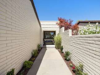 Welcome guests through this charming walkway leading to the entrance of your home.