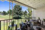 Enjoy your morning coffee or evening relaxation on this charming balcony overlooking a lush green golf course.