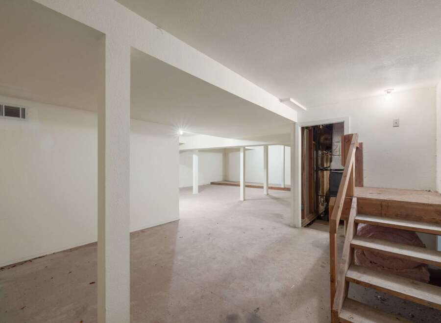 Explore the potential of this unfinished basement, offering a blank canvas for your dream living space.