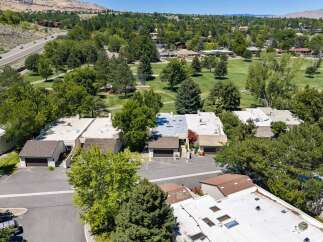 Discover this charming property nestled amidst lush greenery and mature trees, offering a serene retreat.