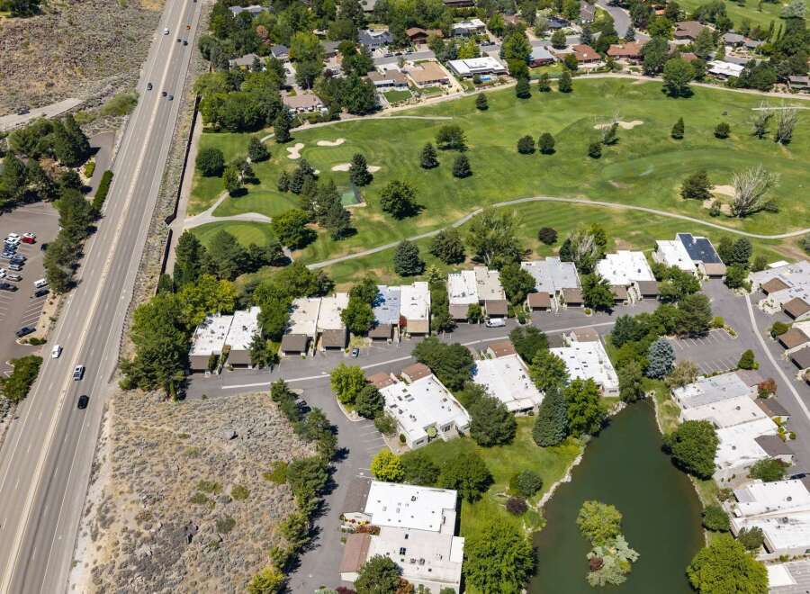 Experience luxury living adjacent to a pristine golf course, offering breathtaking views and a serene atmosphere.