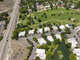 Experience luxury living adjacent to a pristine golf course, offering breathtaking views and a serene atmosphere.