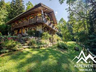 Nestled amidst lush greenery, this charming chalet offers a serene mountain retreat.
