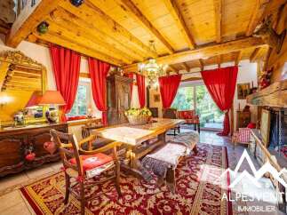 Experience rustic charm in this inviting dining room, featuring a grand wooden table perfect for family gatherings.