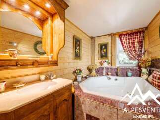 Experience rustic charm in this charming bathroom featuring a luxurious corner bathtub perfect for relaxation.
