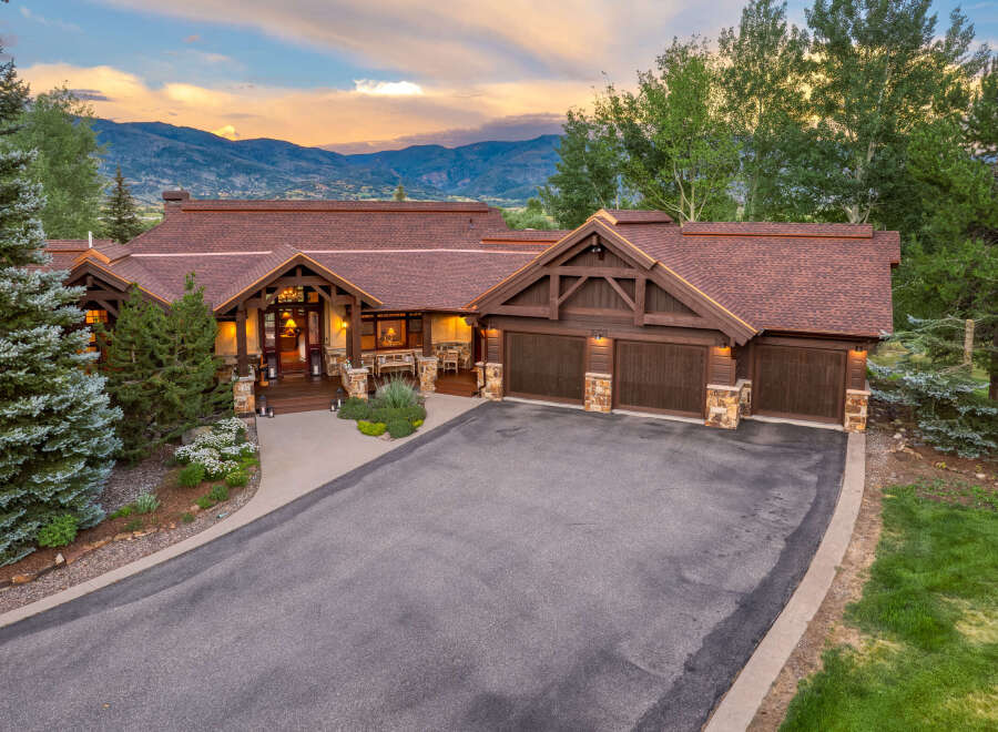 Experience luxury mountain living in this stunning custom-built home, perfectly situated to capture breathtaking sunset views.