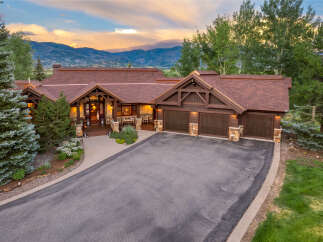 Experience luxury mountain living in this stunning custom-built home, perfectly situated to capture breathtaking sunset views.
