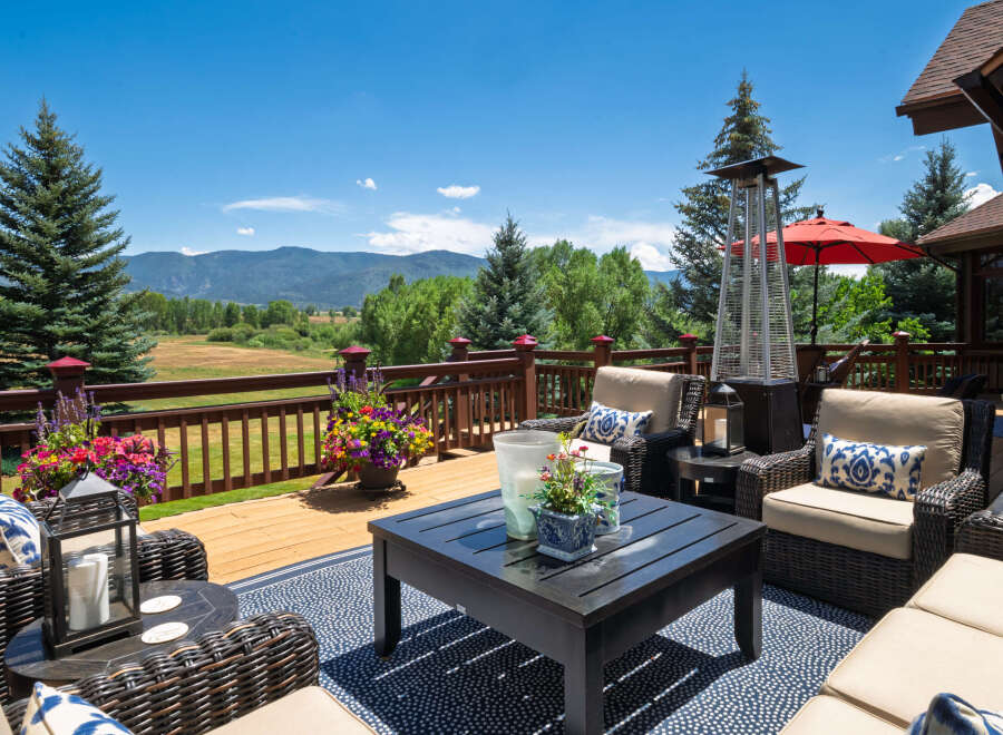 Enjoy breathtaking mountain views from this expansive deck, perfect for outdoor entertaining.