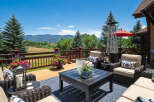 Enjoy breathtaking mountain views from this expansive deck, perfect for outdoor entertaining.