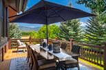 Enjoy breathtaking mountain views from this expansive deck, perfect for outdoor dining and entertaining.