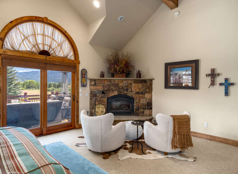 Experience rustic charm and breathtaking mountain views from this inviting living space.