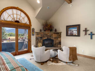 Experience rustic charm and breathtaking mountain views from this inviting living space.