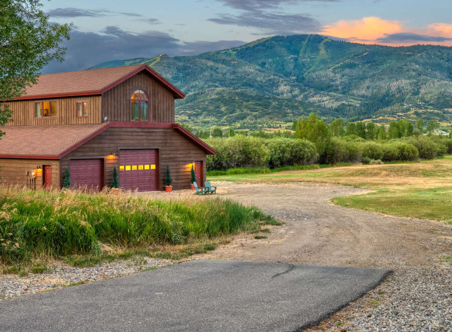 Nestled against a backdrop of majestic mountains, this charming property offers a serene retreat.