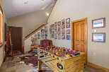 This inviting entryway features a classic foosball table, perfect for family fun and entertainment.