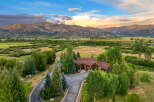 Experience luxury mountain living in this stunning estate, nestled amidst rolling hills and majestic peaks.