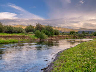 Experience the tranquility of this stunning riverside property, perfect for those seeking a peaceful retreat.