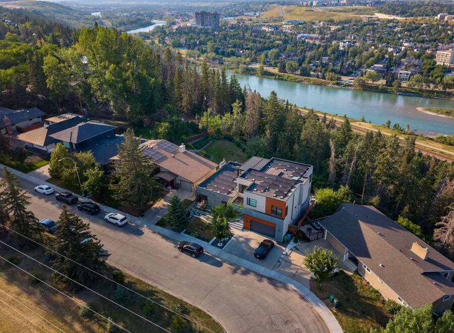 Experience luxury living in this stunning modern home, boasting solar panels for eco-friendly energy and a prime location with breathtaking river views.