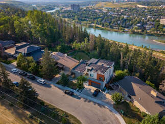 Experience luxury living in this stunning modern home, boasting solar panels for eco-friendly energy and a prime location with breathtaking river views.