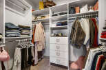 Discover an impeccably organized walk-in closet designed for effortless style.